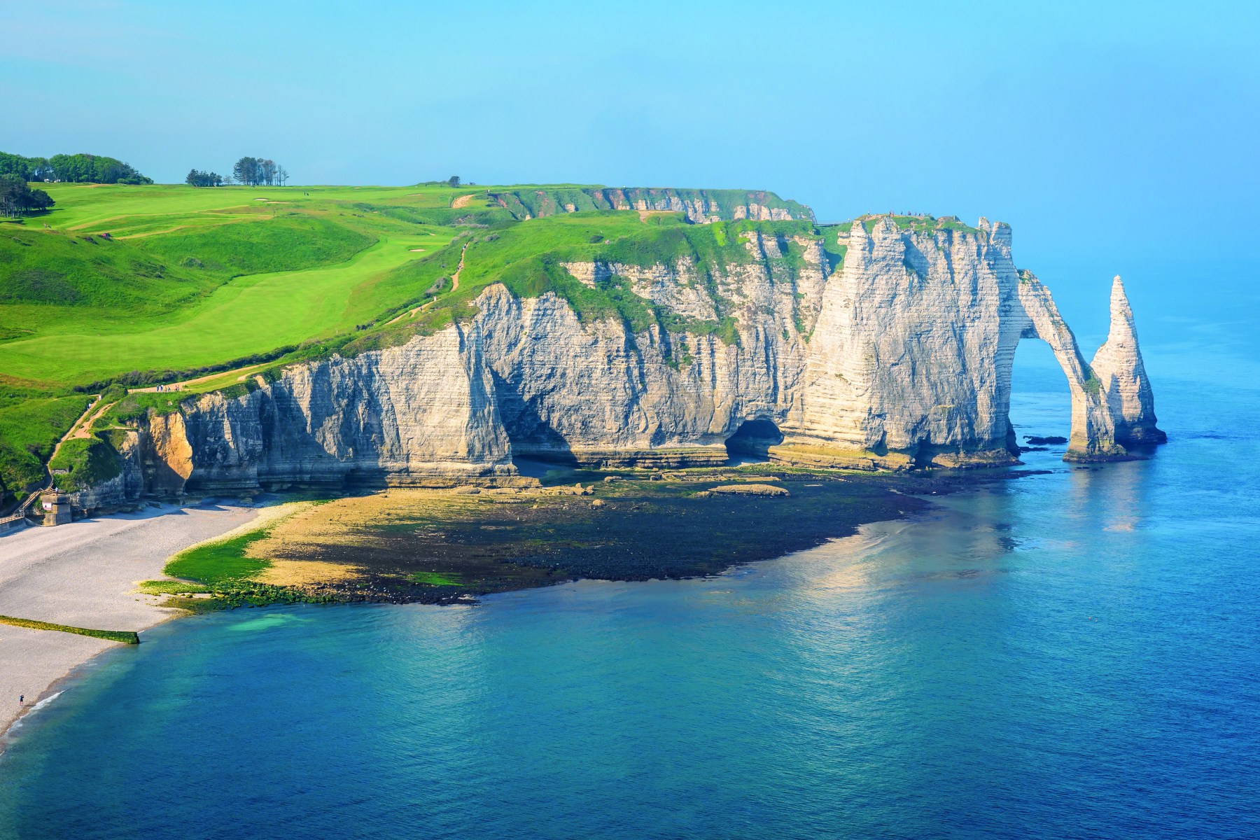 <strong>GOLF D'ÉTRETAT,</strong> France. Many golf courses are built atop cliffs, but not cliffs like these.<br><br>Waldek says: "At Golf d’Étretat in Normandy, the 10th hole is a stunner. The coastal town is known for its white chalk cliffs facing the English Channel, and the hole plays right up to them. The course suffered during World War II when its fairways and greens were filled with landmines."<br>