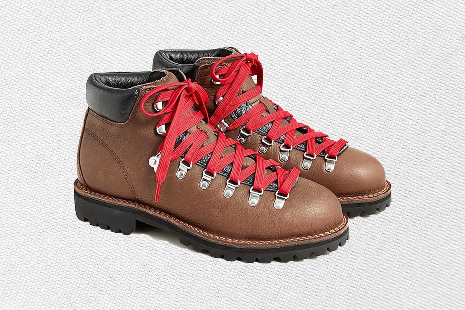 a pair of brown leather hiking boots from J.Crew on a grey background