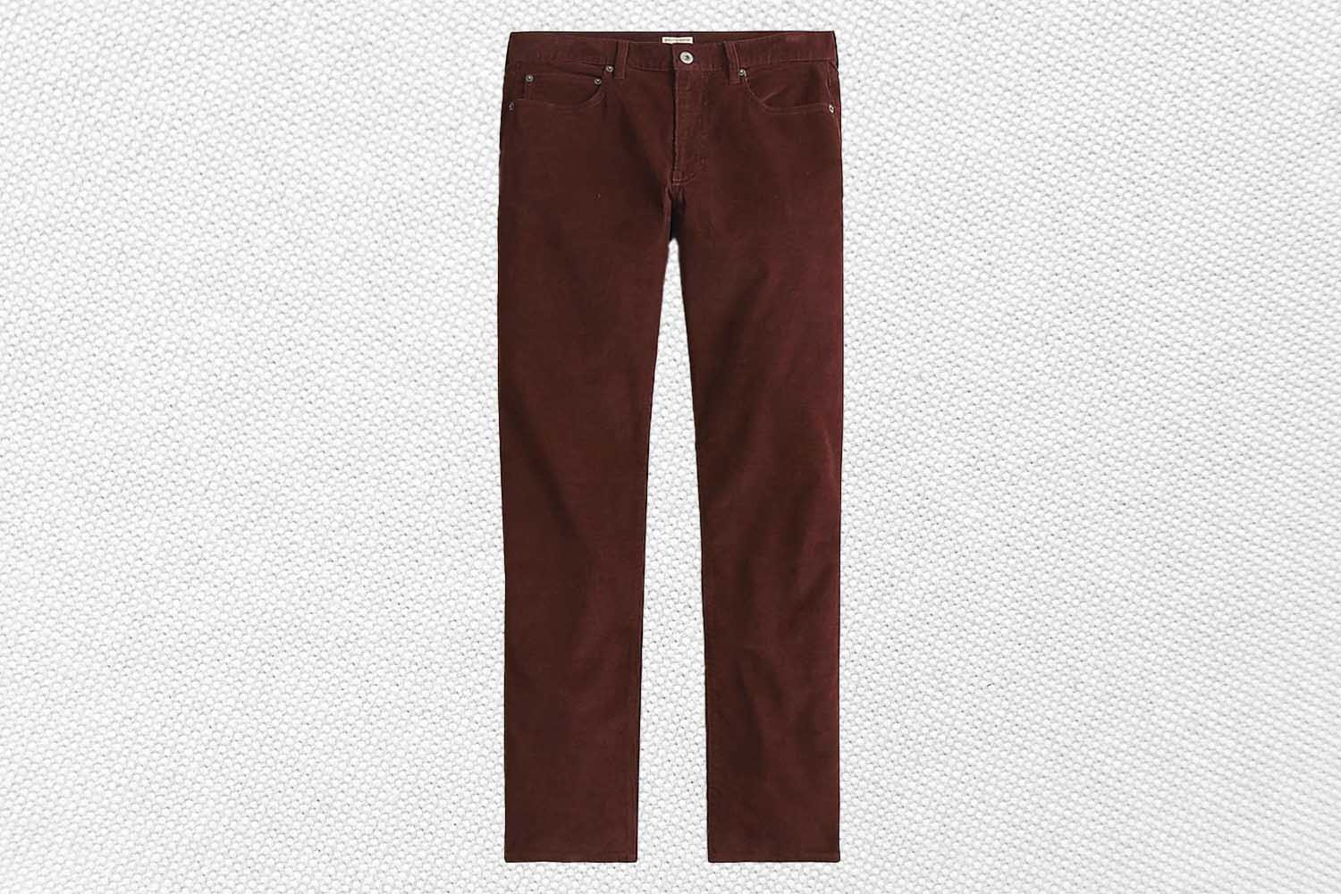 a pair of dark rown corduroy pants from J.Crew on a grey background