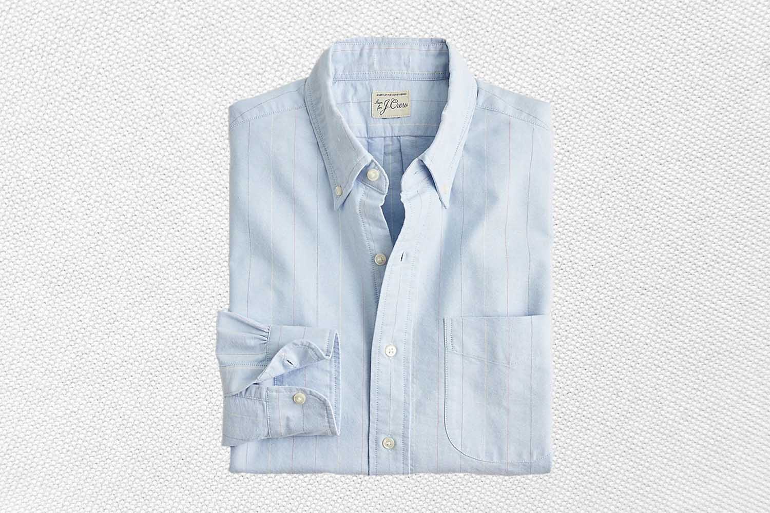a blue oxford shirt from J.Crew on a grey background