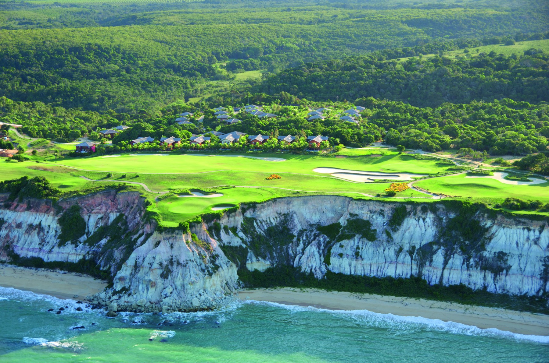 <strong>TERRAVISTA GOLF COURSE</strong>, Brazil. Golfers play through the rainforest before emerging atop oceanfront cliffs.<br> <br>Waldek says: "Terravista in jet-set chic Trancoso allows golfers to enjoy two of the country’s most scenic landscapes: The rainforest and the beach. Four holes abut 150-foot-tall cliffs overlooking the Atlantic; the particularly picturesque hole 14 is the standout as it’s set on a section of the cliffs that juts out over the beaches below."<br>