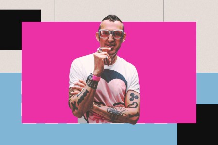 Industrial designer Karim Rashid, with his big trademark glasses, set in a pink, blue, black and grey background