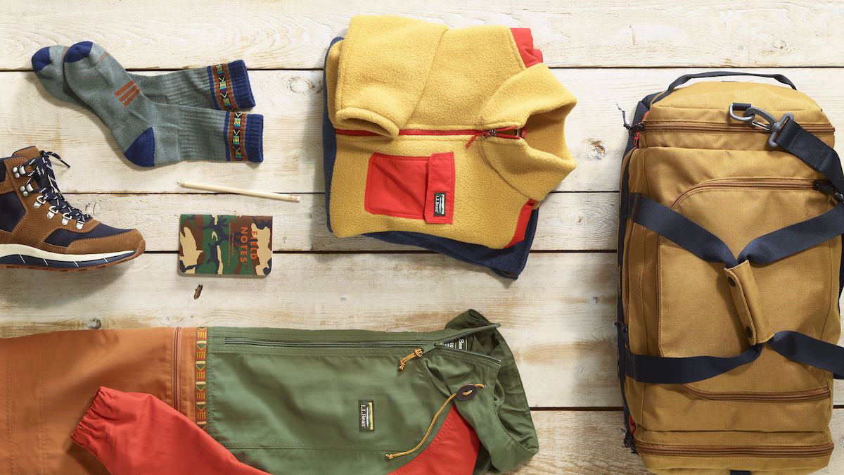 A lifestyle image of the L.L. Bean Mountain Classics Collection layed out on a wooden deck
