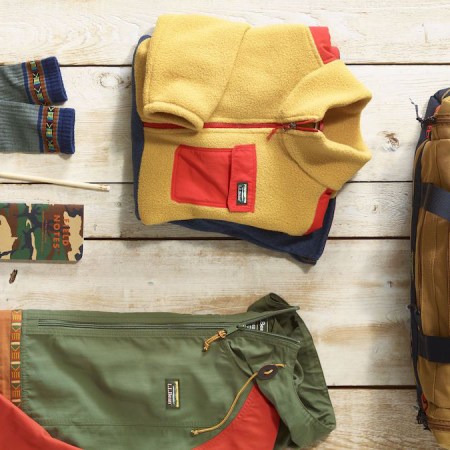 A lifestyle image of the L.L. Bean Mountain Classics Collection layed out on a wooden deck
