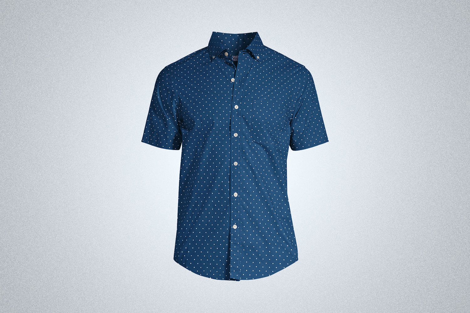 a short-sleeve blue dot button up shirt from Land's End on a grey background