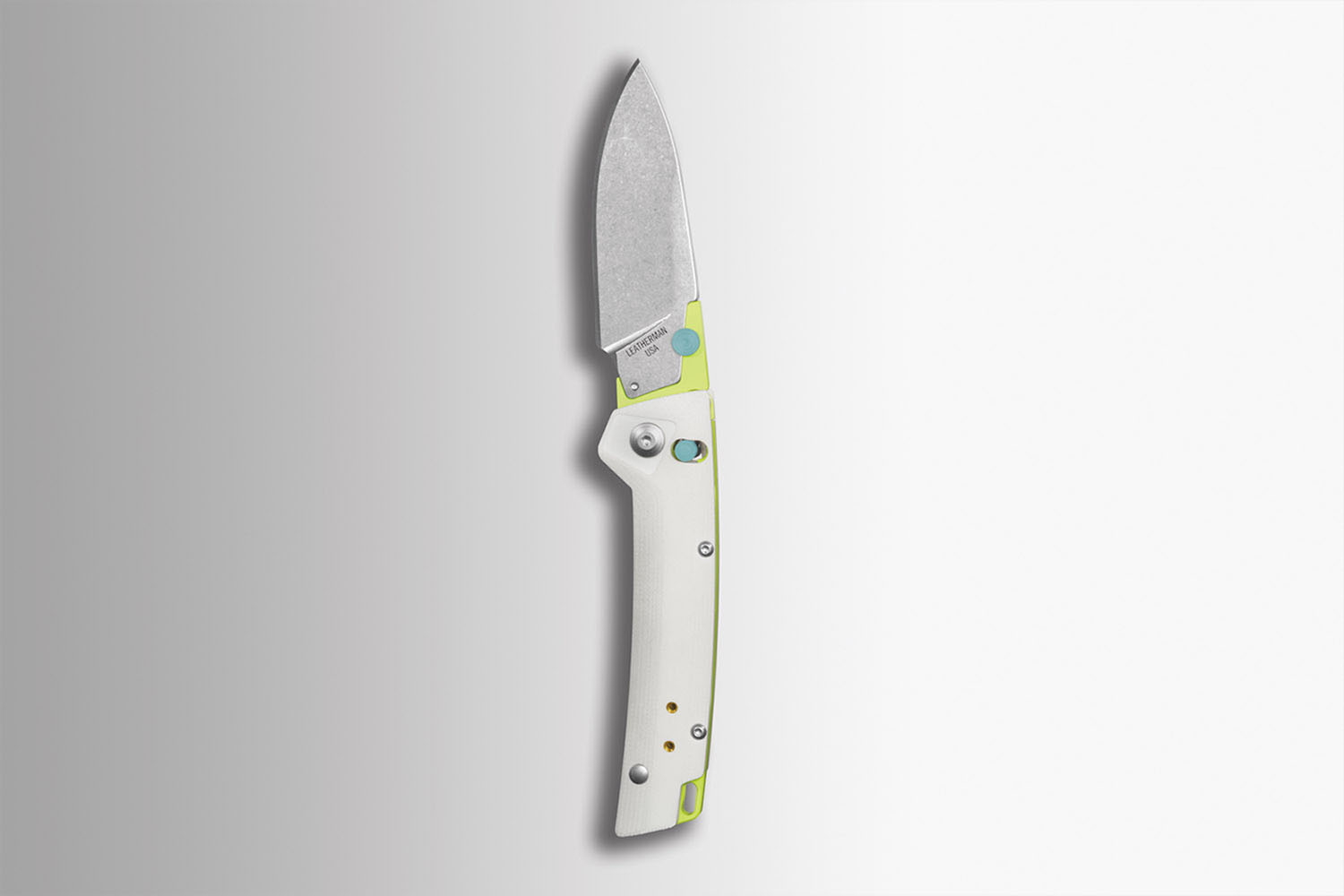 a Leatherman custom knife on a grey background