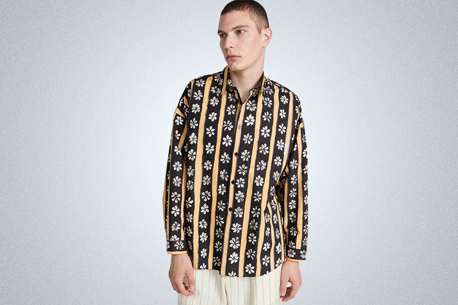 a black and yellow striped flower printed shirt from Marni on a grey background