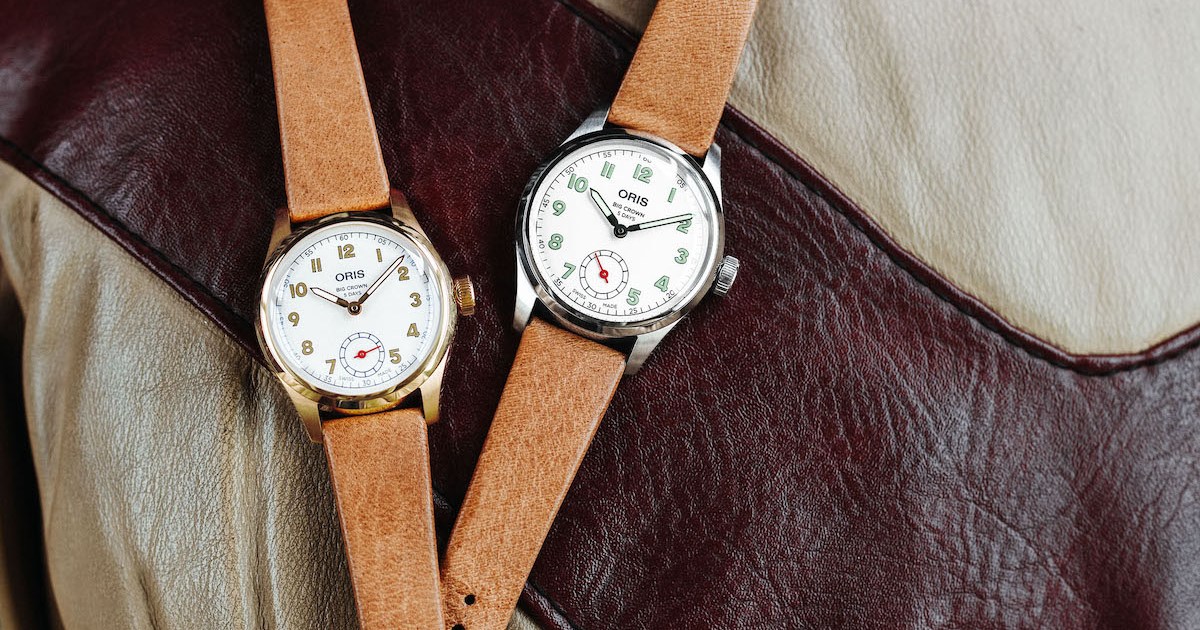 two watches on a leather jacket from Oris