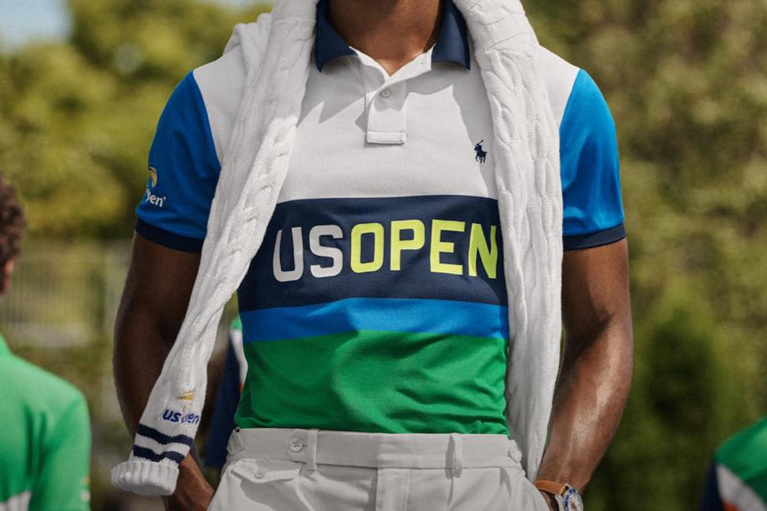 one model against a green background wearing the Polo Ralph Lauren x US Open 2022 Collection