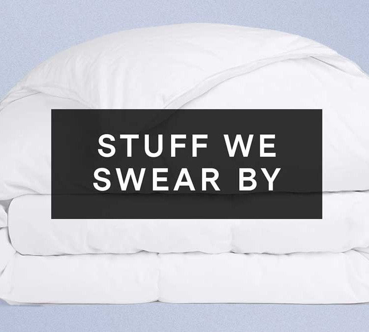 Parachute's Duvet Insert overlaid with "Stuff We Swear By" on a purple background