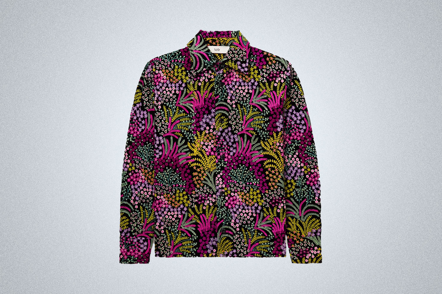 a black shirt with flower prints from Séfr on a grey background
