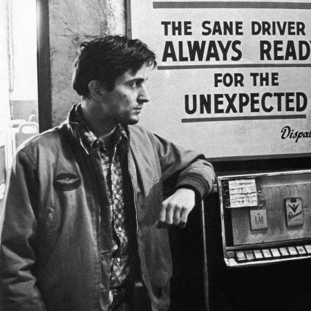 a black and white photograph of a young Robert De Niro from the movie "Taxi Driver"