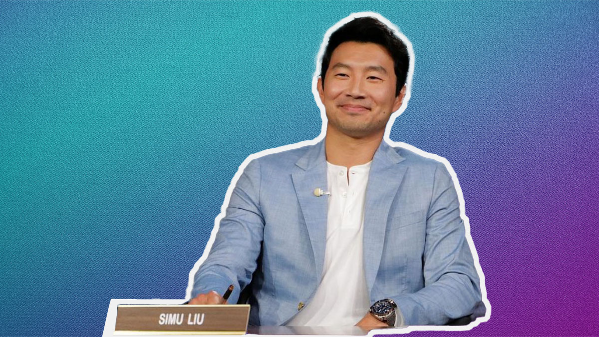 Simu Lui in a chambray blue Bonobos suit on a white and purple gradient background