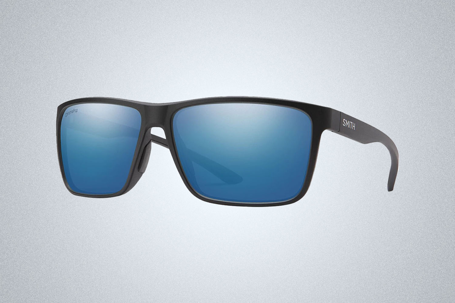 a pair of polarized, blue-lensed black sunglasses from Smith on a grey background