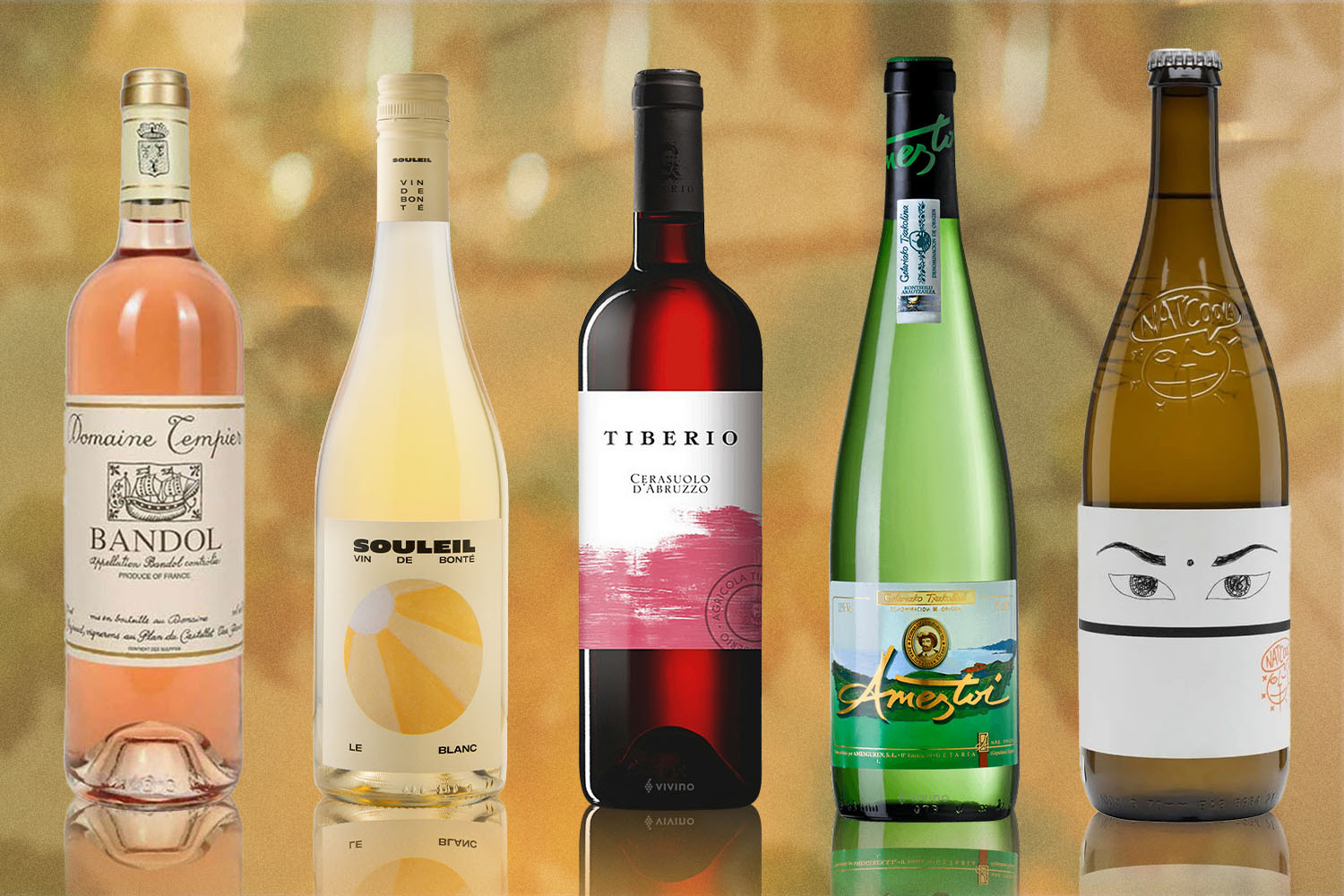 Bottles of white, rose and orange wine recommended by wine writer and sommelier Kate Dingwall on gold backdrop