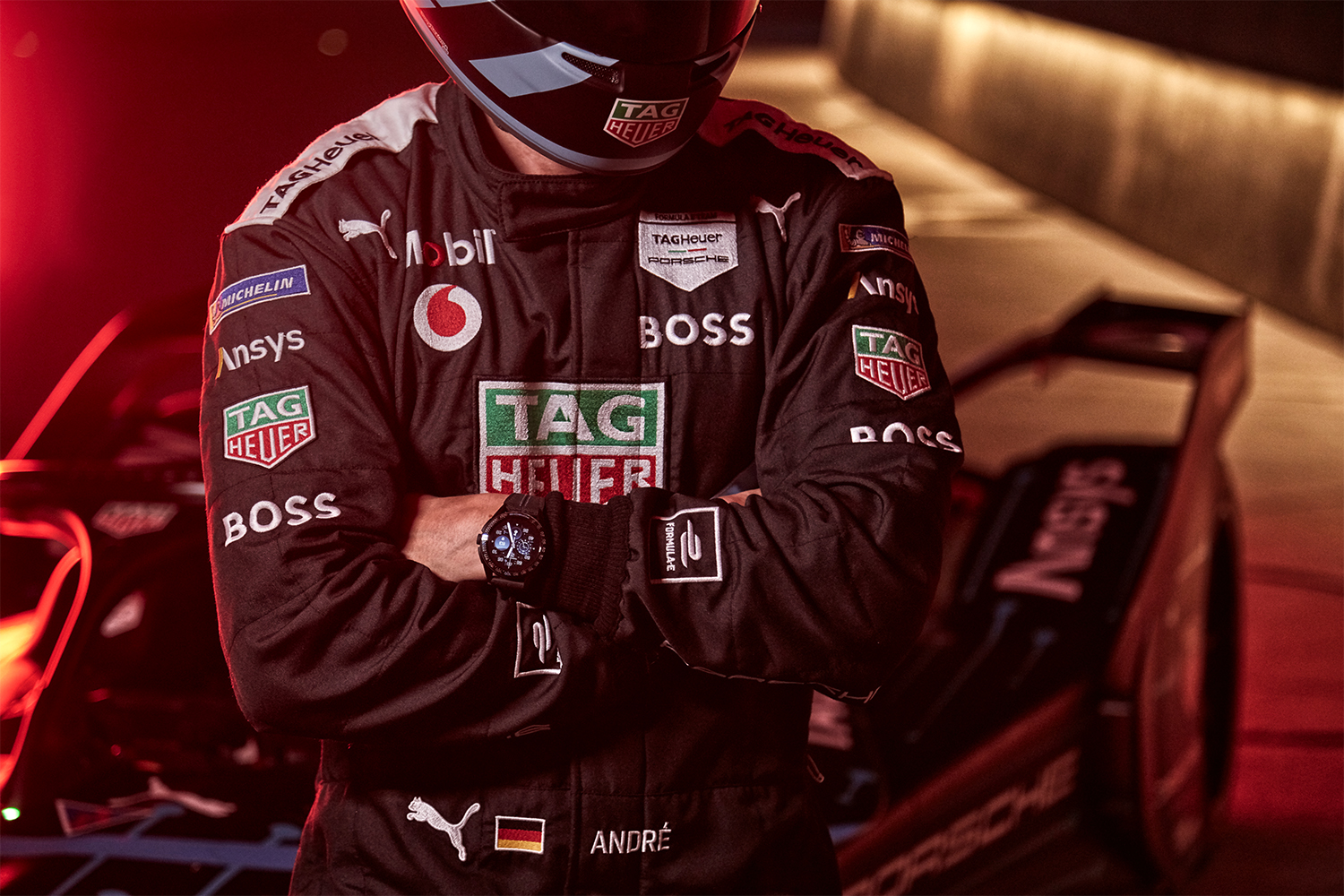 a model in porsche gear wearing the new Tag Heuer Calibre E4 watch