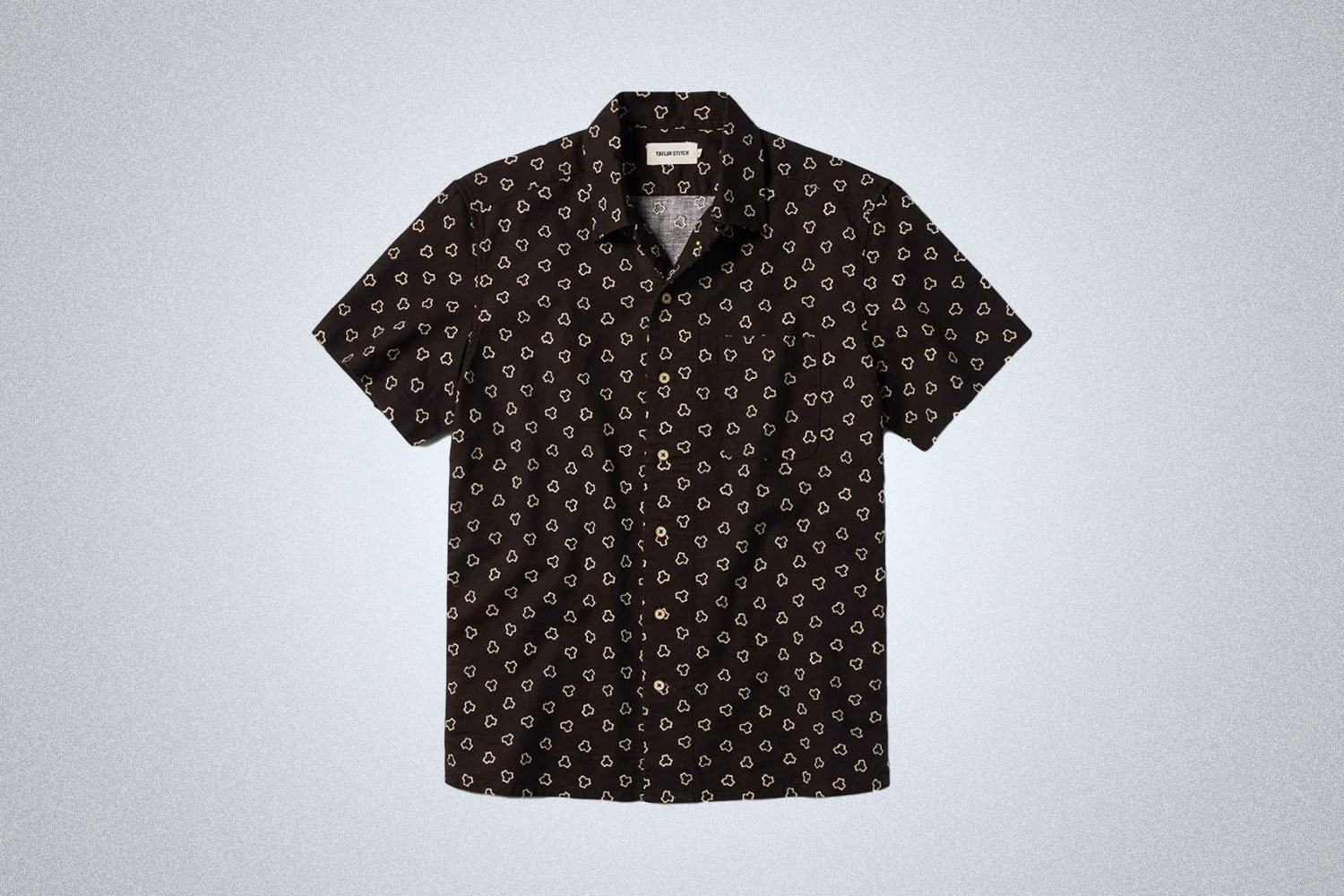 a brown and white patterned shirt from Taylor Stitch on a grey background