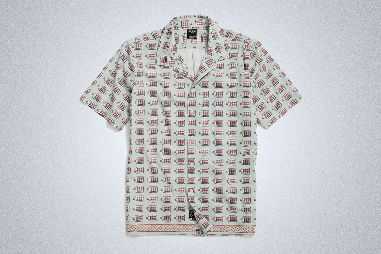 a light-toned camp collar shirt from Todd Snyder on a grey background