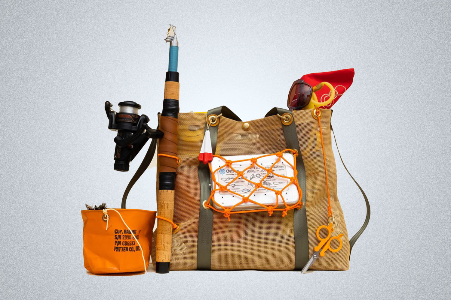 a William Ellery tote bag full of gear on a grey background