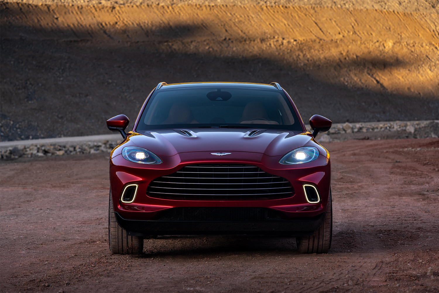 A red Aston Martin DBX, the British automaker's first SUV