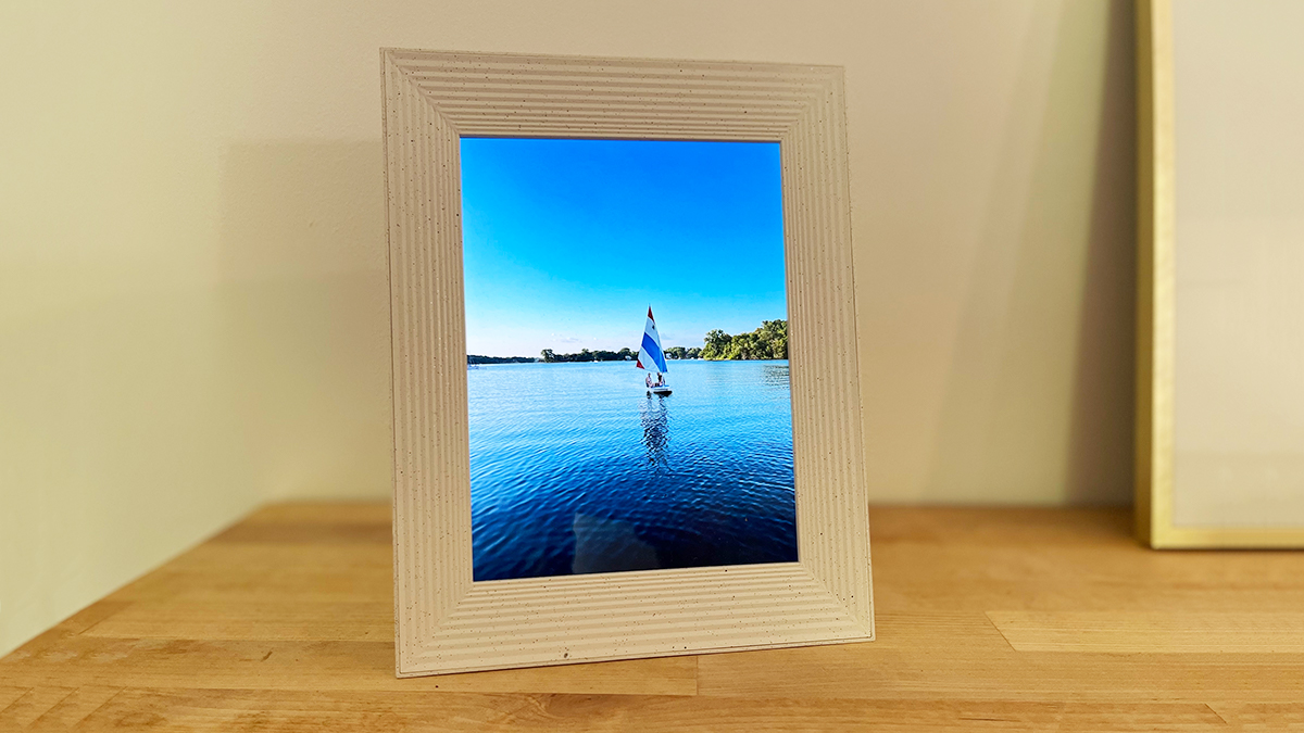 A pictures of a sailboat in a digital photo frame from Aura Frames