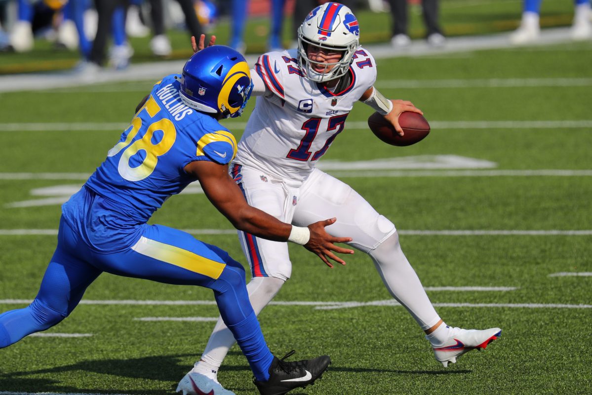 Josh Allen of the Bills evades Justin Hollins of the Rams during a 2020 game.