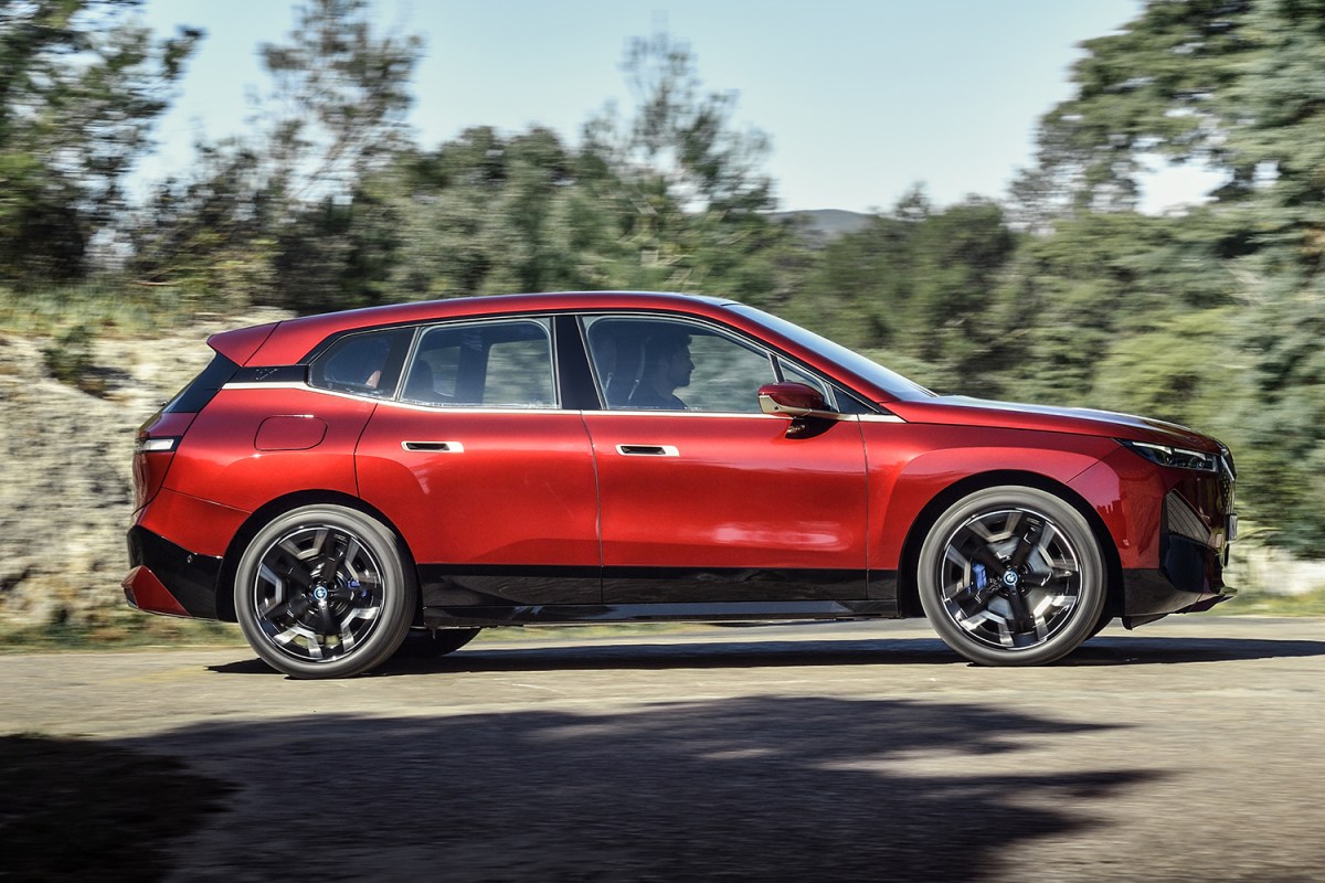 The BMW iX xDrive50 electric SUV in red