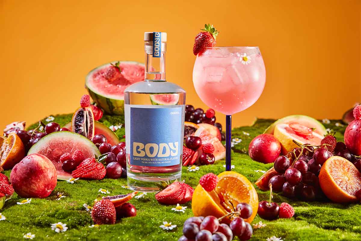 BODY vodka bottle and a cocktail on a table filled with fruit. BODY is the rare sub-80-proof "vodka"