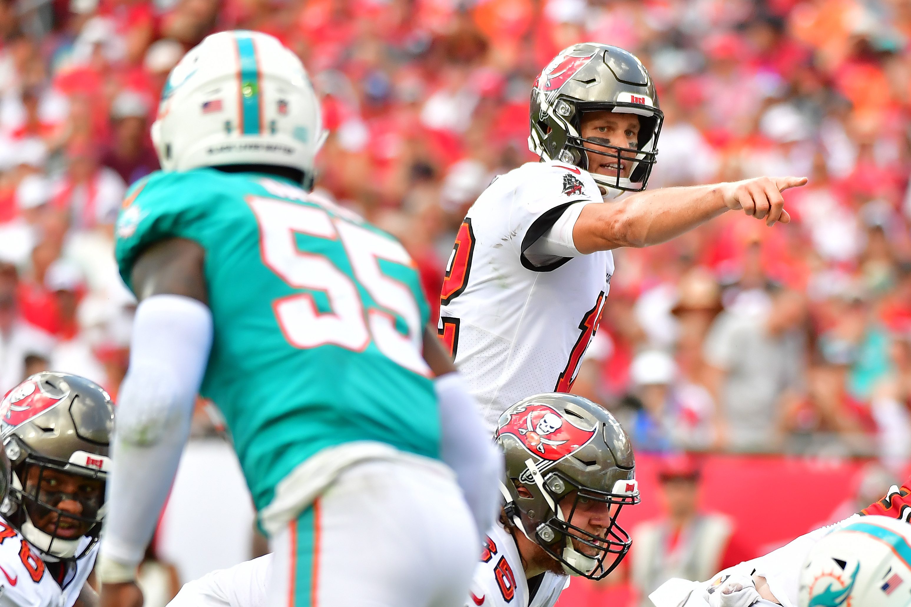 Tom Brady looks on under center against the Miami Dolphins in 2021