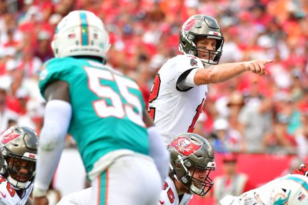 Tom Brady looks on under center against the Miami Dolphins in 2021