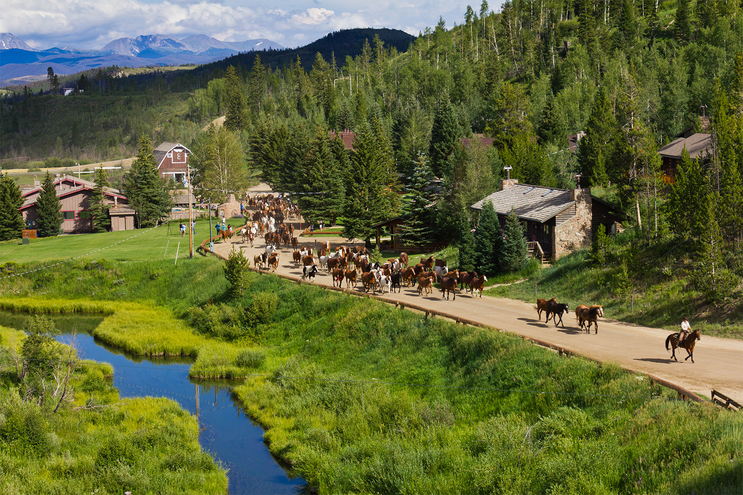 Dozens of horses and riders at C Lazy U Ranch in Colorado, one of the best luxury ranch resorts in the U.S.