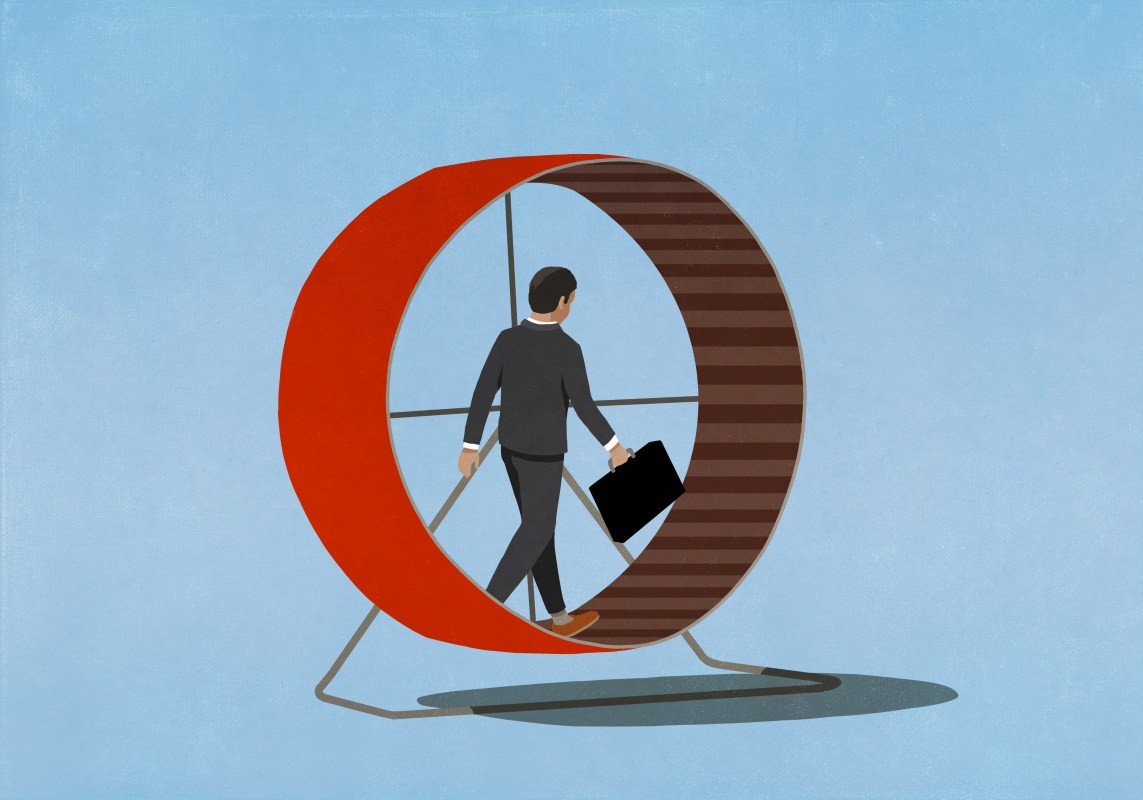 An illustration of a businessman in a suit carrying a briefcase while walking on a hamster wheel.