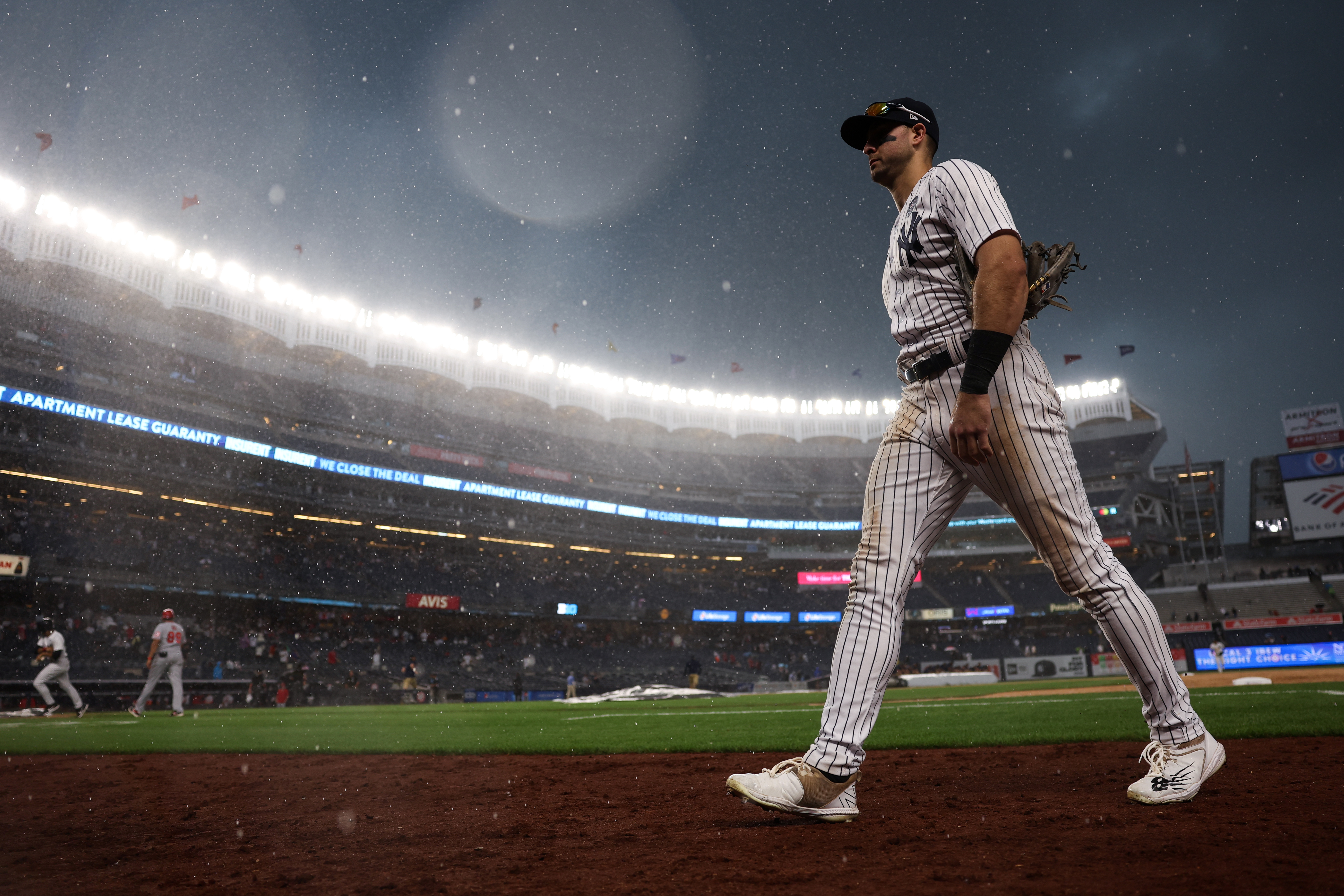 Joey Gallo walks off the field at Yankee Stadium during a rain delay.