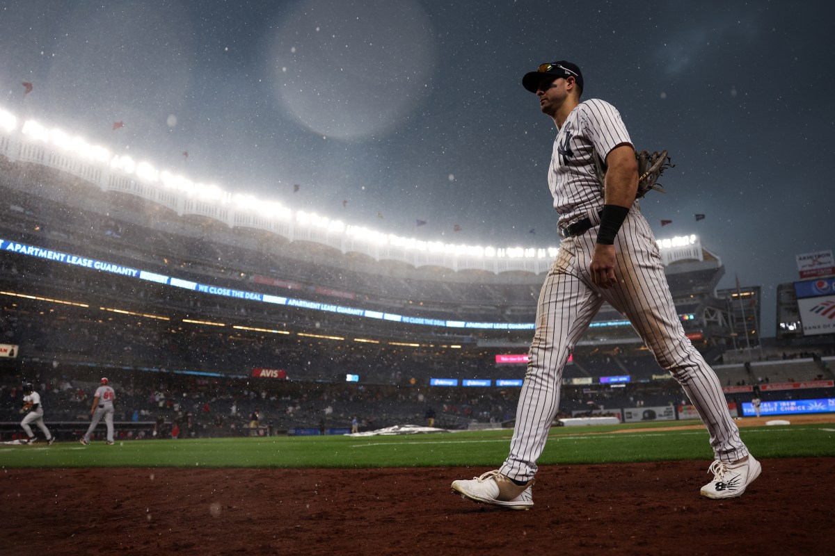 Joey Gallo walks off the field at Yankee Stadium during a rain delay.