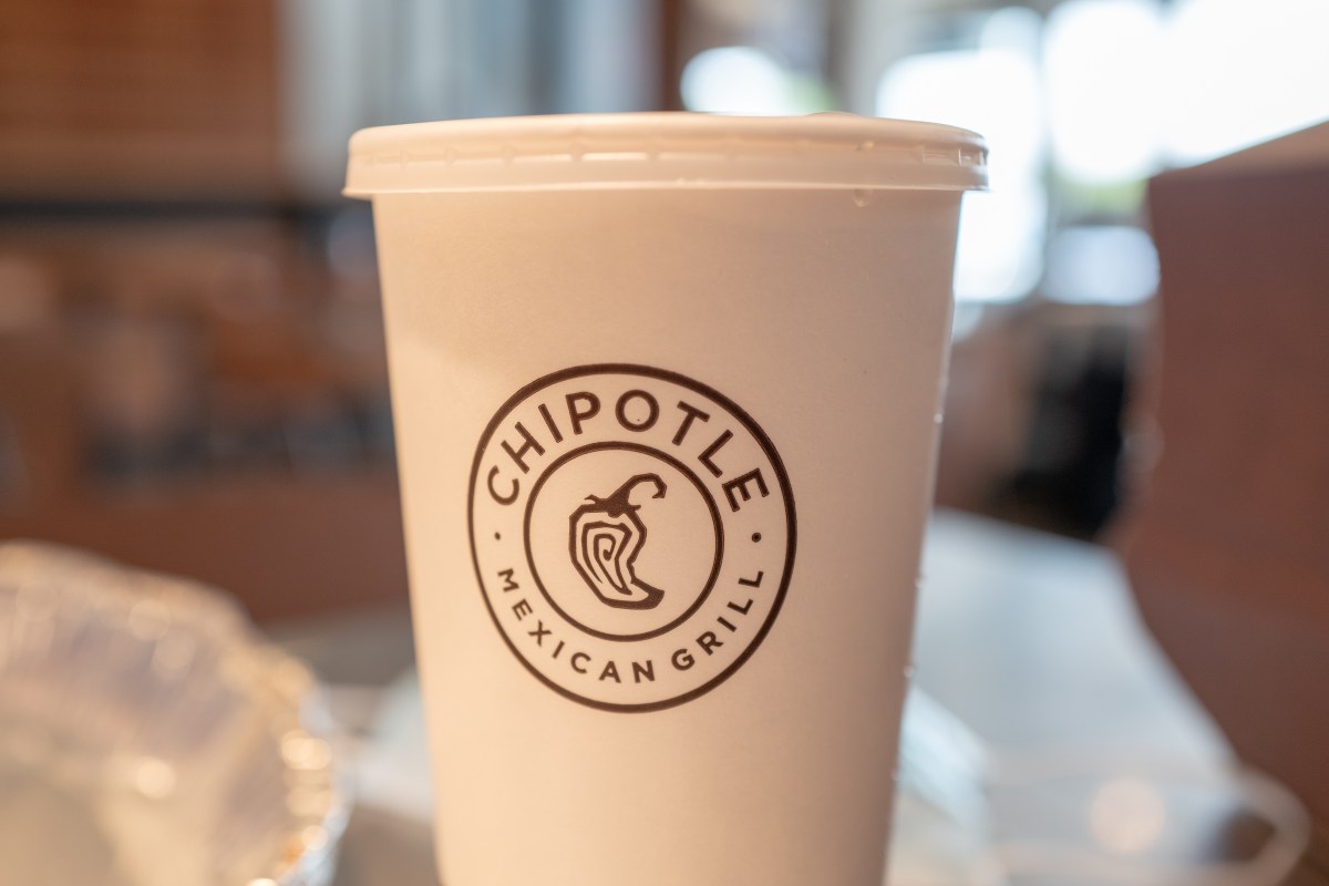 A Chipotle cup resting on a table.