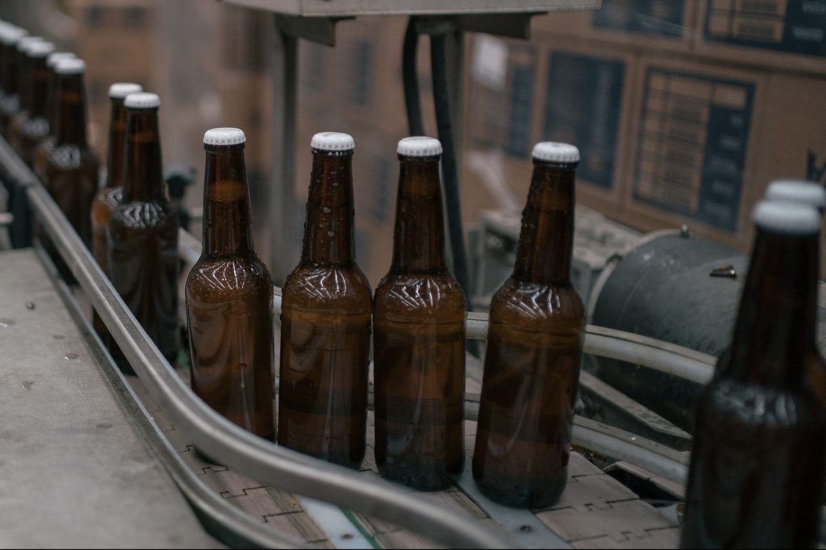 Bottles of beer move along a conveyor at the Cerveza Minerva facility in Mexico.
