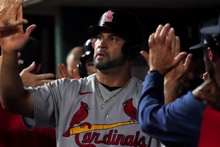 Albert Pujols of the St. Louis Cardinals celebrates scoring a run