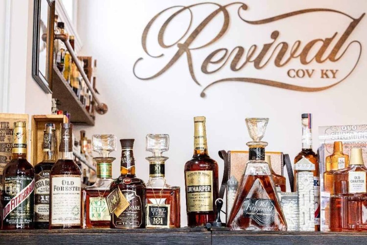 Some vintage bottles on a bar top at Covington, KY's Revival Vintage Spirits