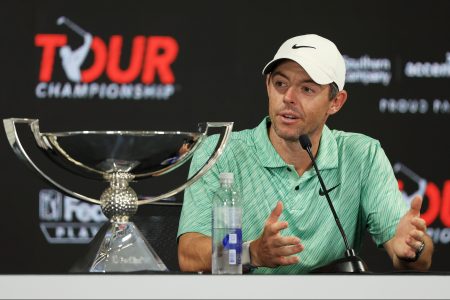 PGA Tour defender Rory McIlroy of Northern Ireland celebrates winning the FedEx Cup in 2022, and throwing shade at the LIV Golf Series