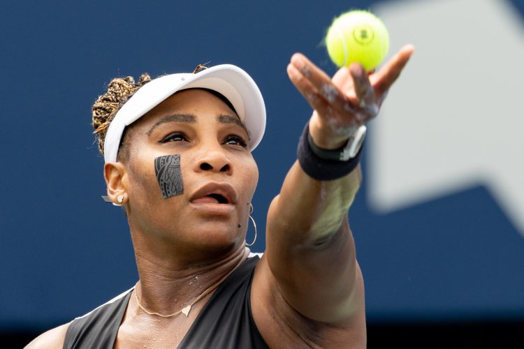 Serena Williams serves a ball at the National Bank Open tennis tournament.