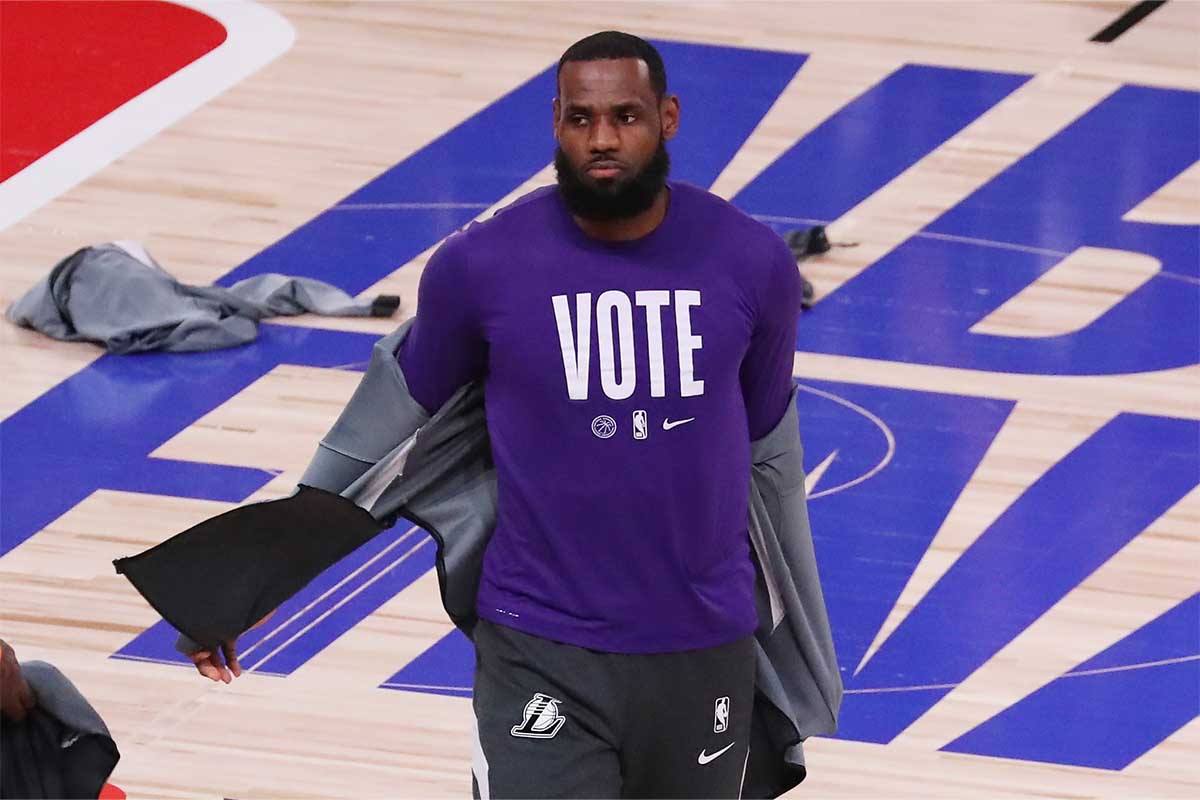 LeBron James #23 of the Los Angeles Lakers wears a VOTE shirt during warm-up prior to the start of the game against the Miami Heat in Game Five of the 2020 NBA Finals at AdventHealth Arena at the ESPN Wide World Of Sports Complex on October 9, 2020 in Lake Buena Vista, Florida