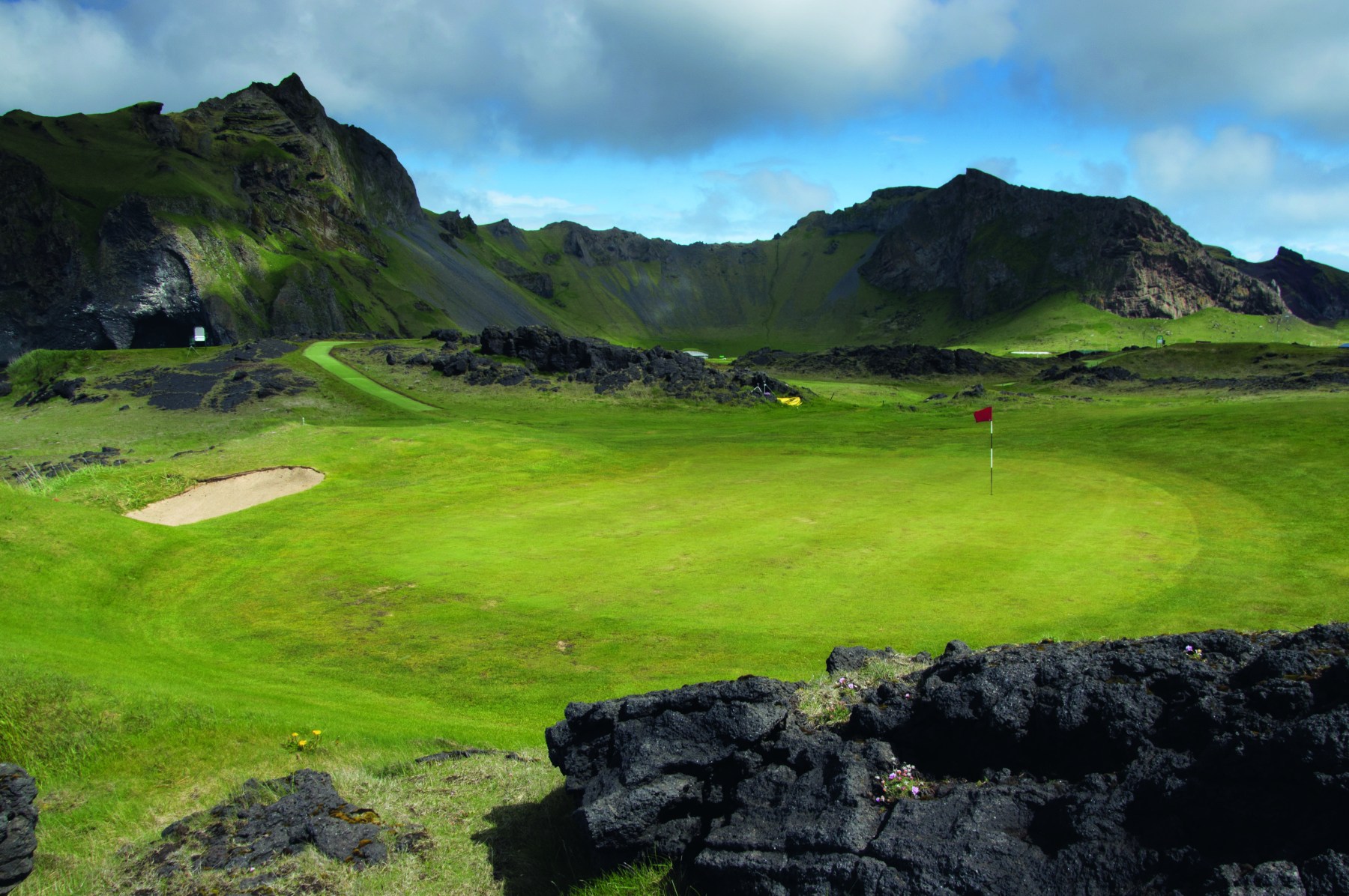 <strong>WESTMAN ISLANDS GOLF CLUB</strong>, Iceland. You’ll be golfing in an old volcano.<br><br>Waldek says: “Iceland is the land of fire and ice, but when you’re golfing at the Westman on Heimaey Island, it’s definitely more fire than ice. Or at least it used to be — the course is built into an old volcano. But don’t worry, it’s extinct, so you probably don’t have to worry about any lava hazards. A neighboring volcano on the island did erupt in 1973.”<br>