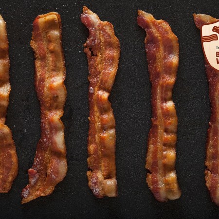 Strips of bacon on a baking pan