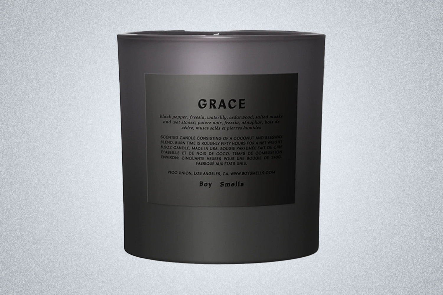 a black "Grace" candle by Boy Smells on a gray background