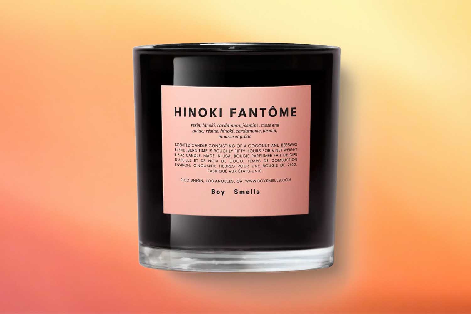 Boy Smells Hinoki Fantom, one of the best fall candles for 2022 on an orange background