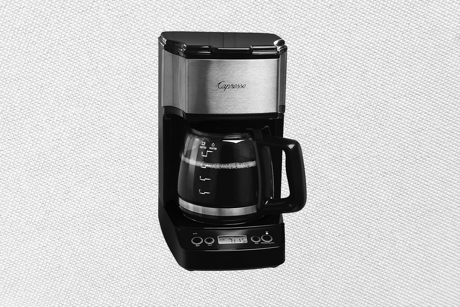 The Capresso 5-Cup Mini Drip Coffee Maker on a white patterned background