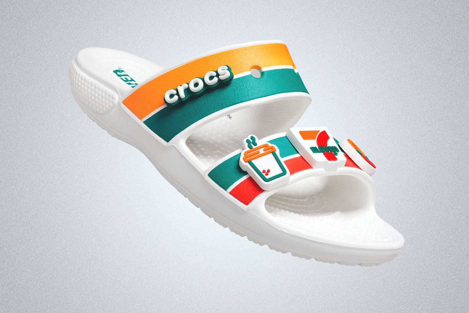 a Croc shoe with 7/11 branding and giblets on a grey background