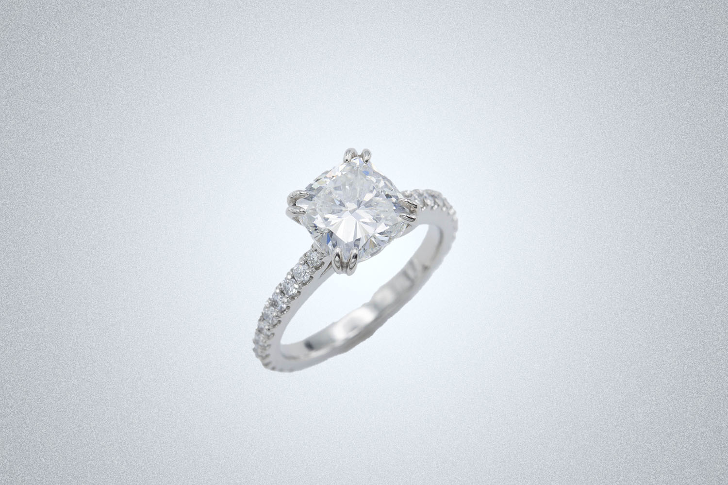 A CustomMade Engagement Ring on a gray background