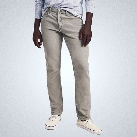 a model in a pair of grey Faherty 5-pocket jenas on a grey background