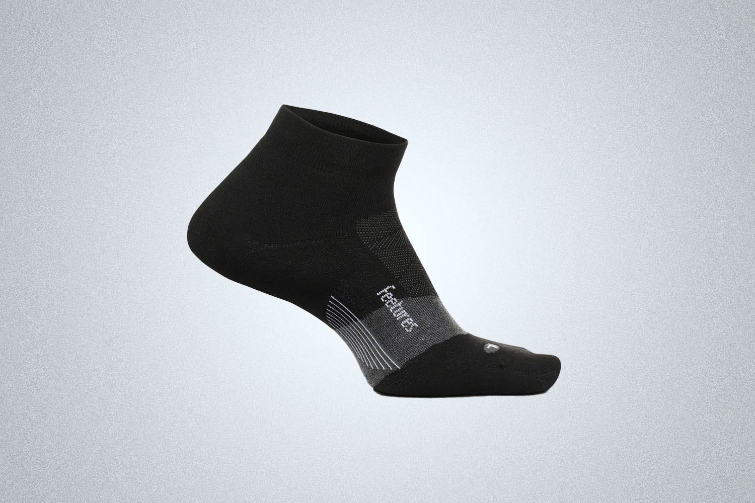 The Feetures Elite Golf Max Cushion Socks on a gray background